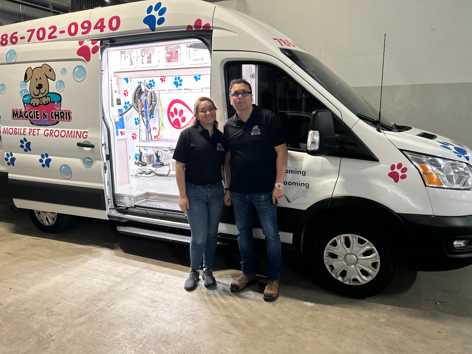 Maggie and Christian with the mobile grooming van